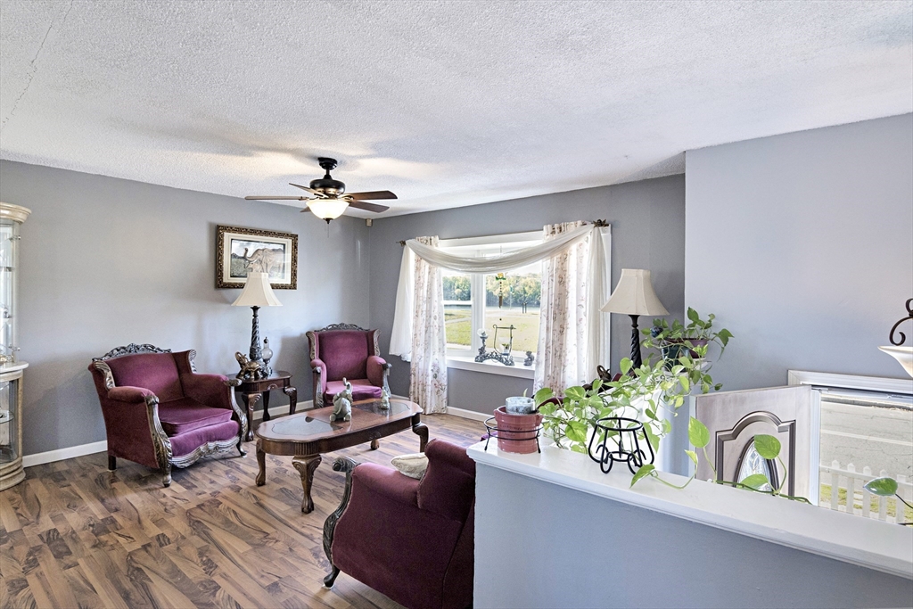 485 Riverside Road Springfield, MA 01107 - Photo 13 of 33 a living room with furniture and a large window