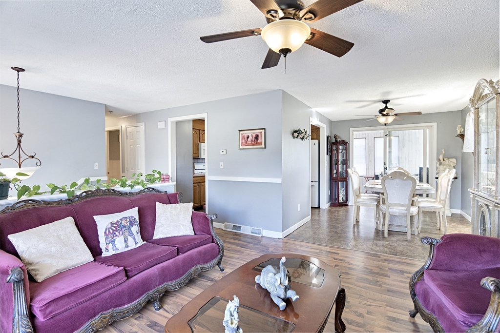485 Riverside Road Springfield, MA 01107 - Photo 14 of 33 a living room with furniture and a view of kitchen
