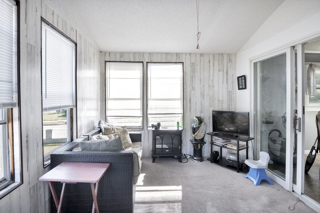 485 Riverside Road Springfield, MA 01107 - Photo 20 of 33 a living room with furniture and a flat screen tv