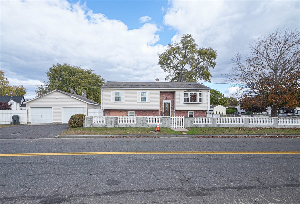 485 Riverside Road Springfield, MA 01107 - Photo 2 of 33 front view of a house with a street