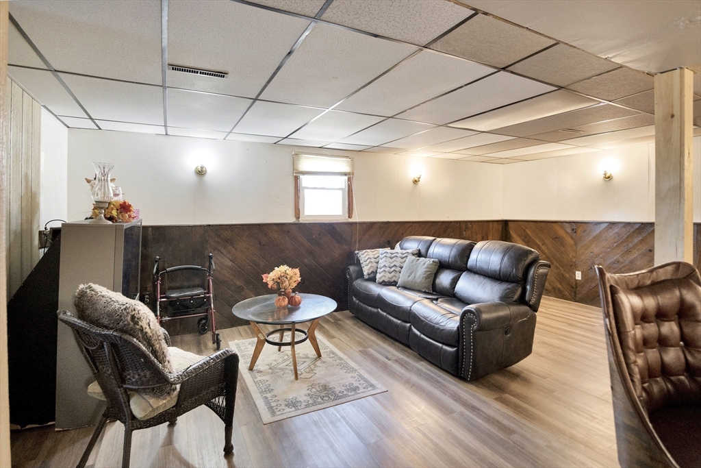 485 Riverside Road Springfield, MA 01107 - Photo 27 of 33 a living room with furniture and wooden floor