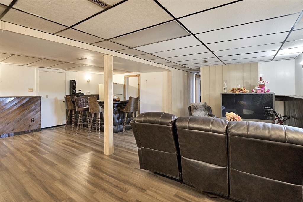 485 Riverside Road Springfield, MA 01107 - Photo 28 of 33 a living room with furniture and a flat screen tv