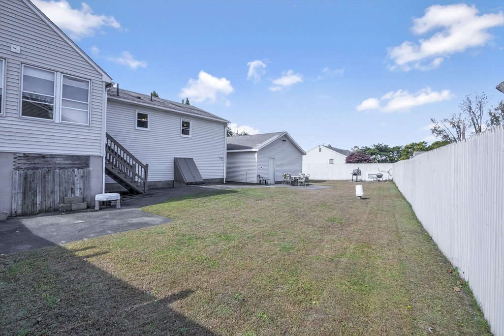 485 Riverside Road Springfield, MA 01107 - Photo 6 of 33 a view of a house with a backyard