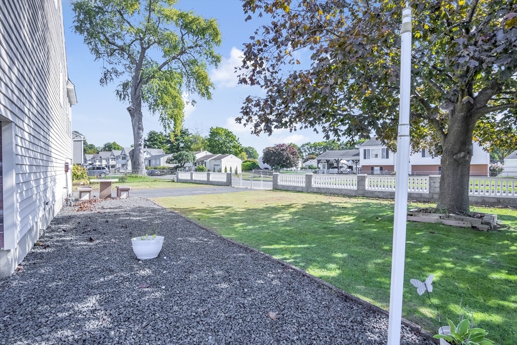 485 Riverside Road Springfield, MA 01107 - Photo 8 of 33 a view of yard with tree and green space