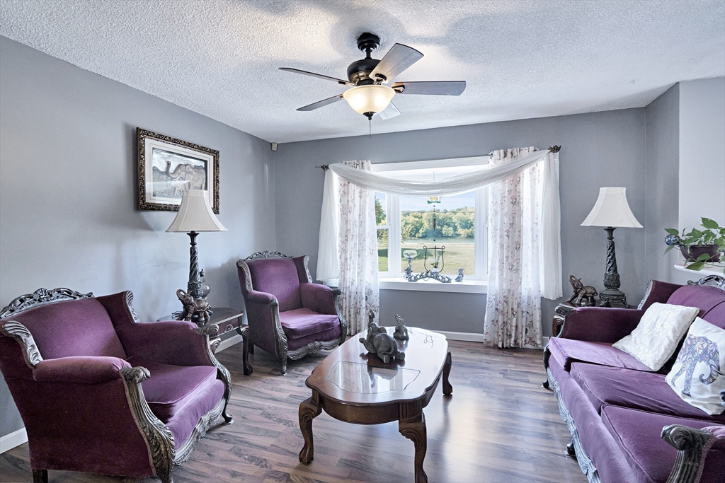 485 Riverside Road Springfield, MA 01107 - Photo 10 of 33 a living room with furniture and a large window