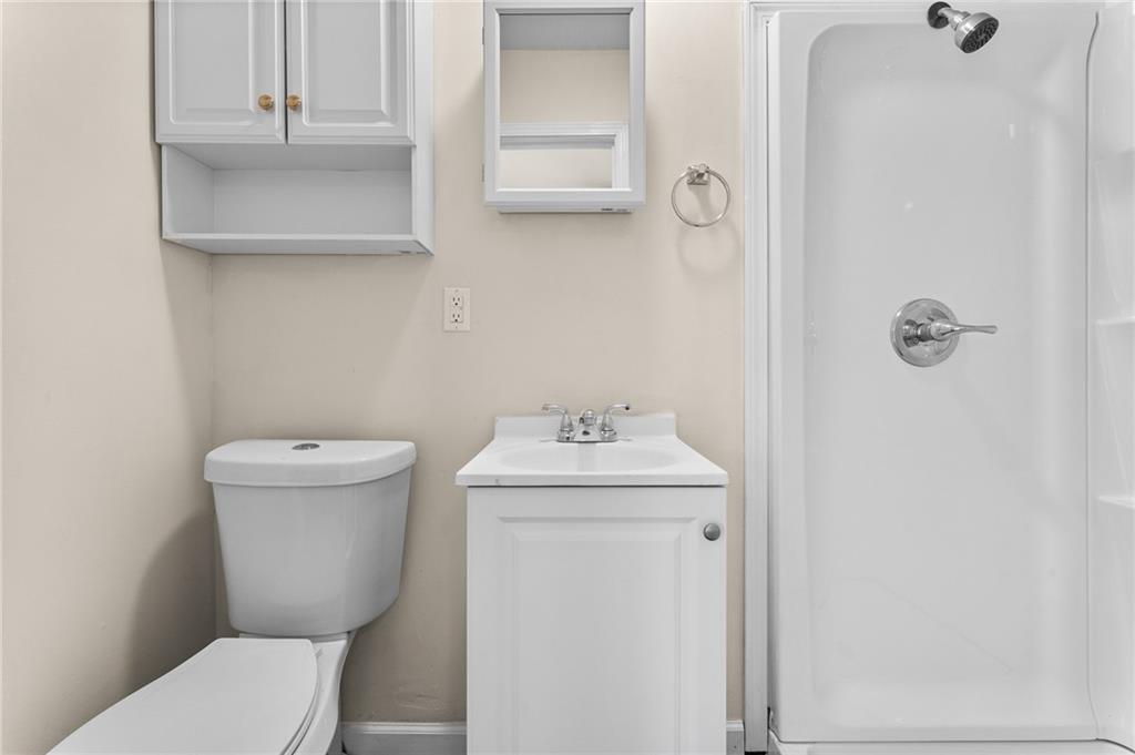 427 Adams Street Rochester, PA 15074 - Photo 18 of 25 a bathroom with a toilet a sink and mirror