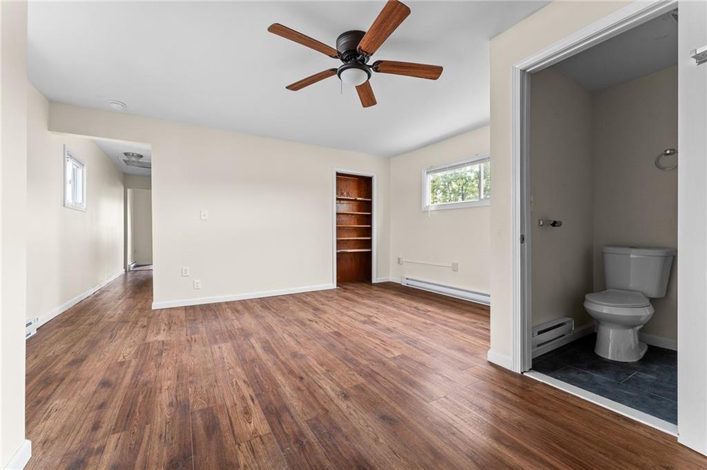 427 Adams Street Rochester, PA 15074 - Photo 5 of 25 a view of a room with wooden floor and a ceiling fan