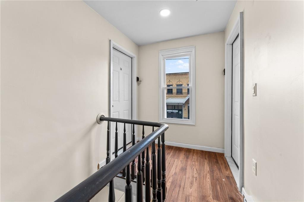 427 Adams Street Rochester, PA 15074 - Photo 6 of 25 a view of a hallway with wooden floor and entryway