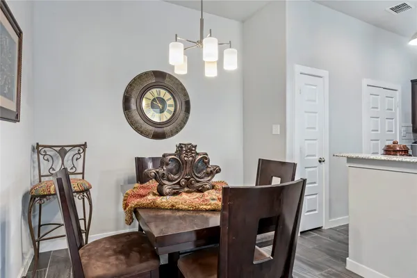 a living room with furniture a flat screen tv and a window