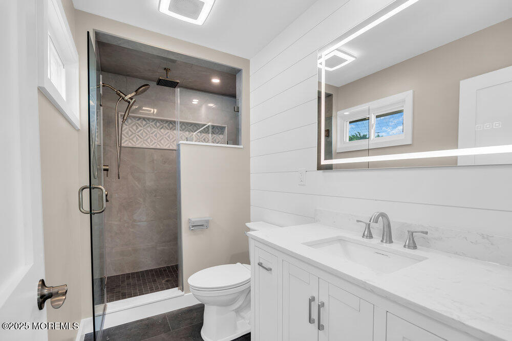 590 Lloyd Road Aberdeen, NJ 07747 - Photo 20 of 71 a bathroom with a sink toilet and shower