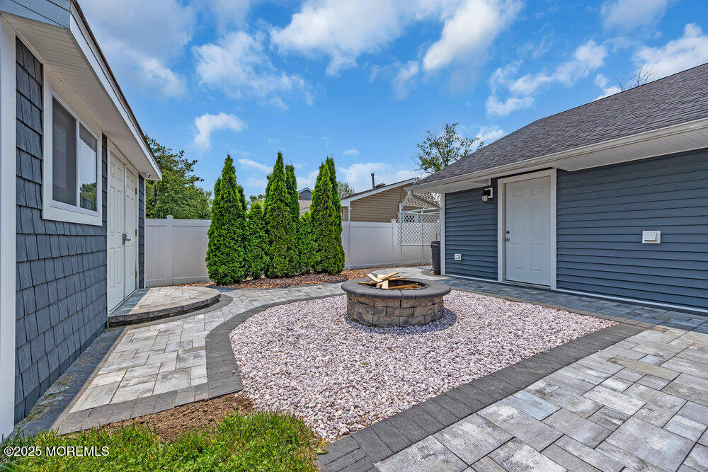 590 Lloyd Road Aberdeen, NJ 07747 - Photo 33 of 71 a front view of house with yard and entertaining space
