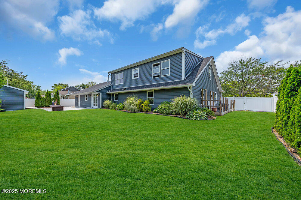 590 Lloyd Road Aberdeen, NJ 07747 - Photo 38 of 71 a view of a house with a big yard plants and large trees