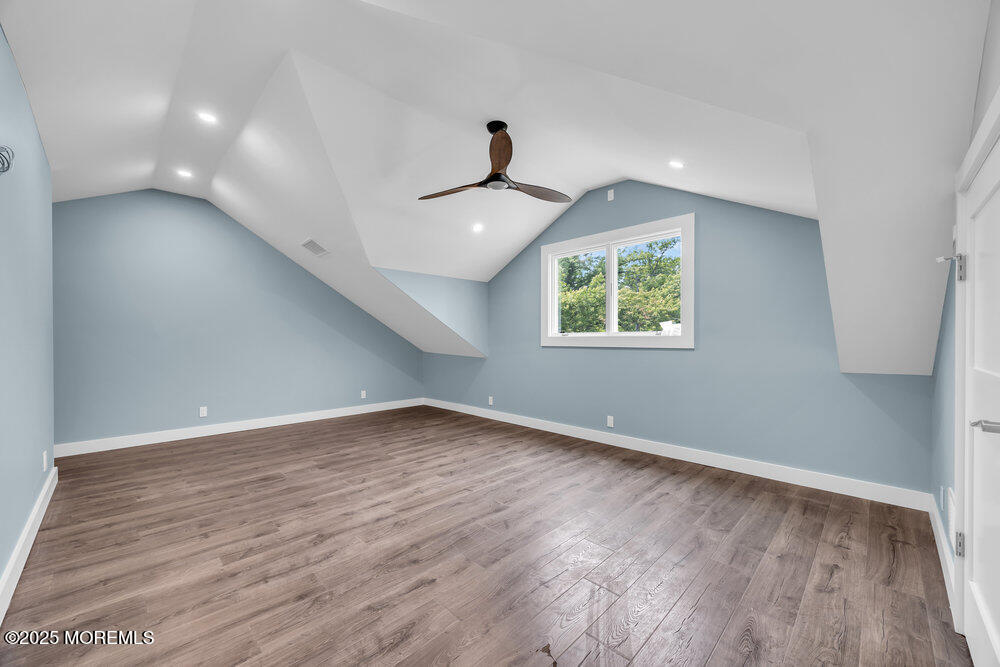 590 Lloyd Road Aberdeen, NJ 07747 - Photo 66 of 71 wooden floor in an empty room with a window