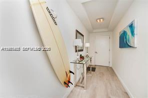 45 Southwest 9th Street, Unit 1701 Miami, FL 33130 - Photo 12 of 24 a view of a livingroom with wooden floor and stairs