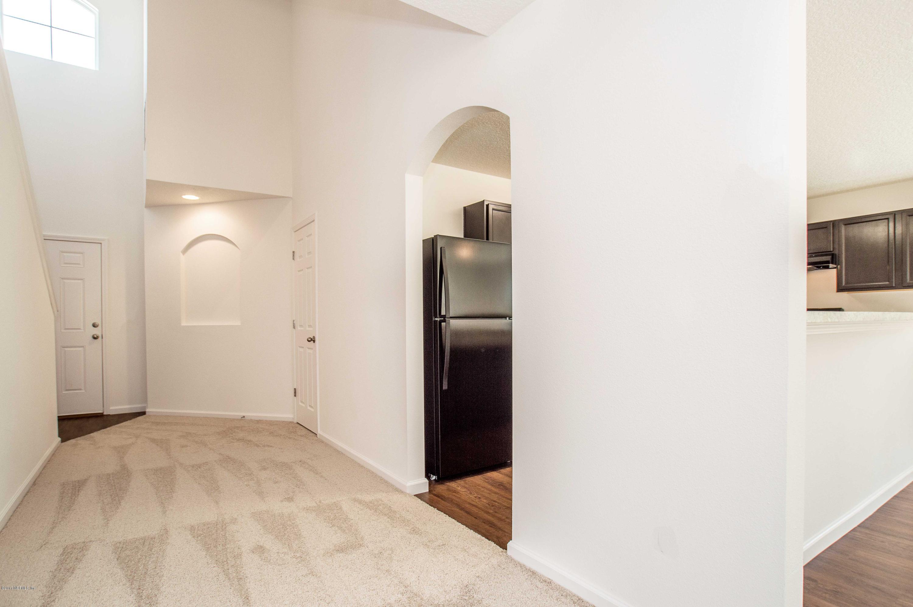 78263 Saddle Rock Road Yulee, FL 32097 - Photo 2 of 13 a view of a livingroom with wooden floor
