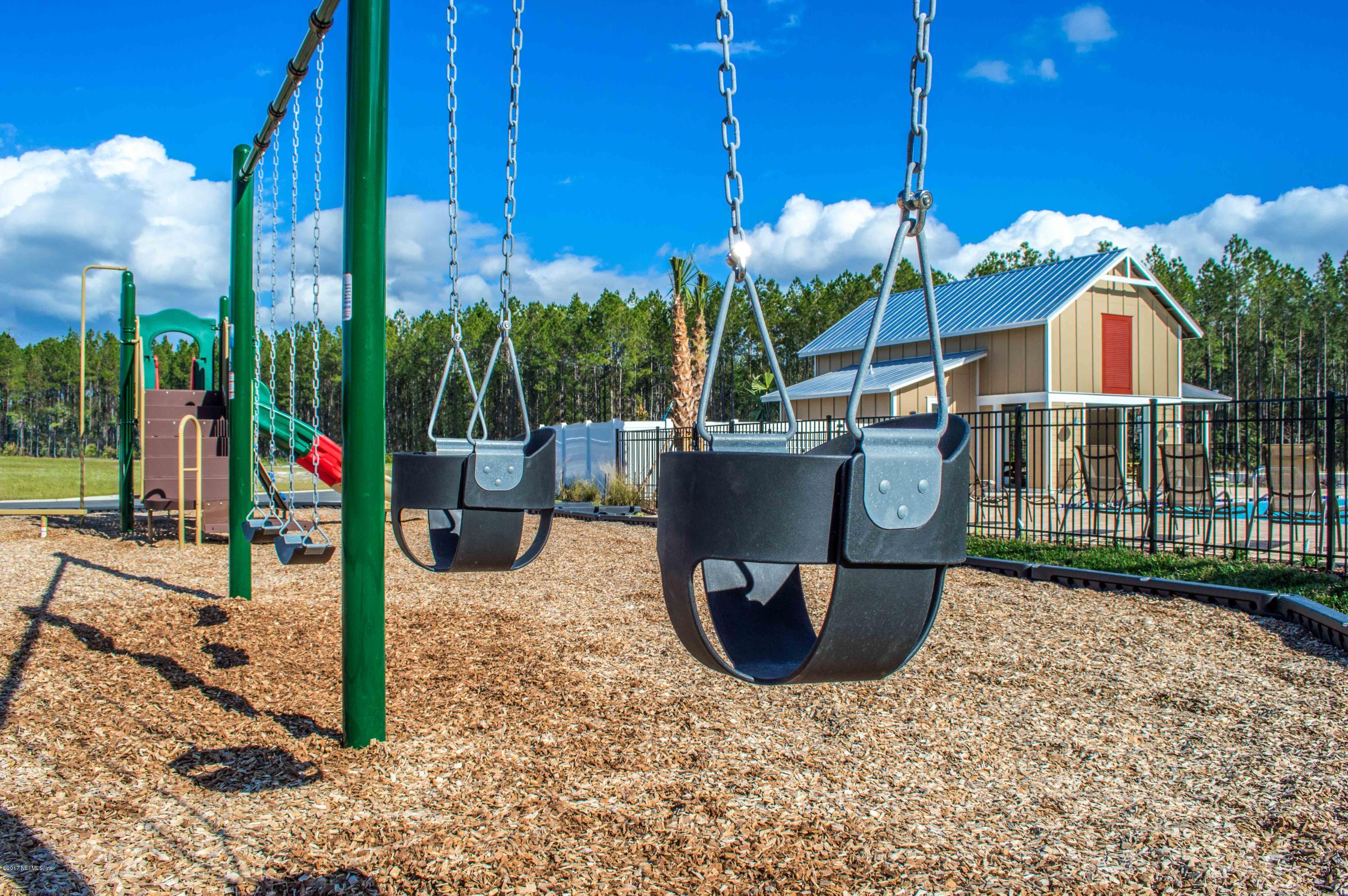 78263 Saddle Rock Road Yulee, FL 32097 - Photo 4 of 13 a view of a backyard with plants