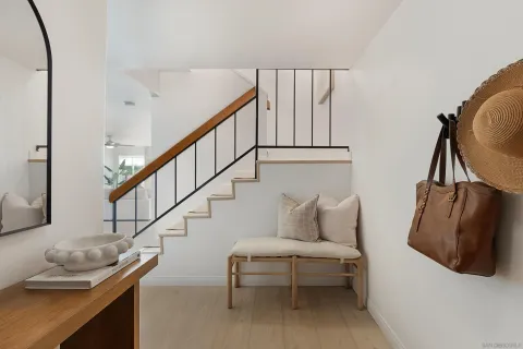 a bedroom with furniture and stairs