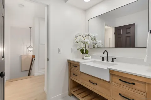 a bathroom with a sink and a mirror