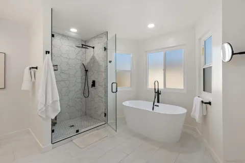 a bathroom with a bathtub and shower