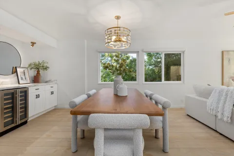 a view of a dining room with furniture window and outside view