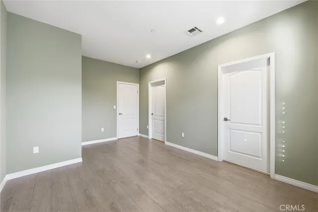 a bathroom with a toilet a sink a mirror a bathtub and shower