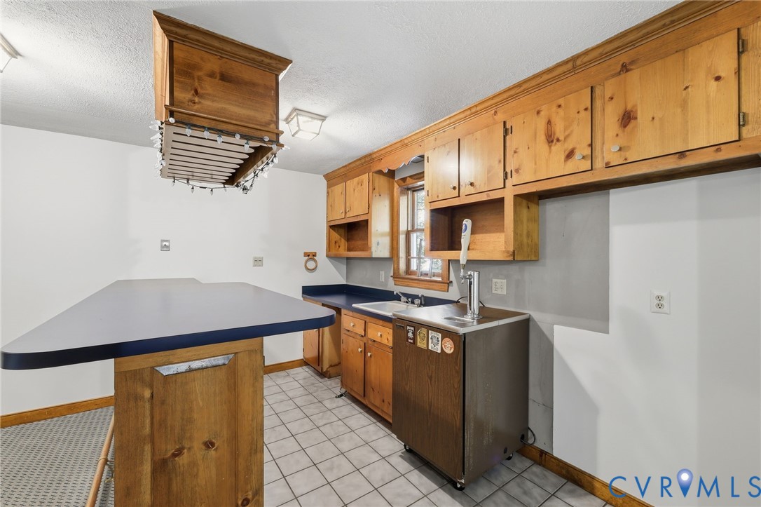 3201 East Brigstock Road Midlothian, VA 23113 - Photo 28 of 72 a kitchen with stainless steel appliances granite countertop a sink stove and cabinets