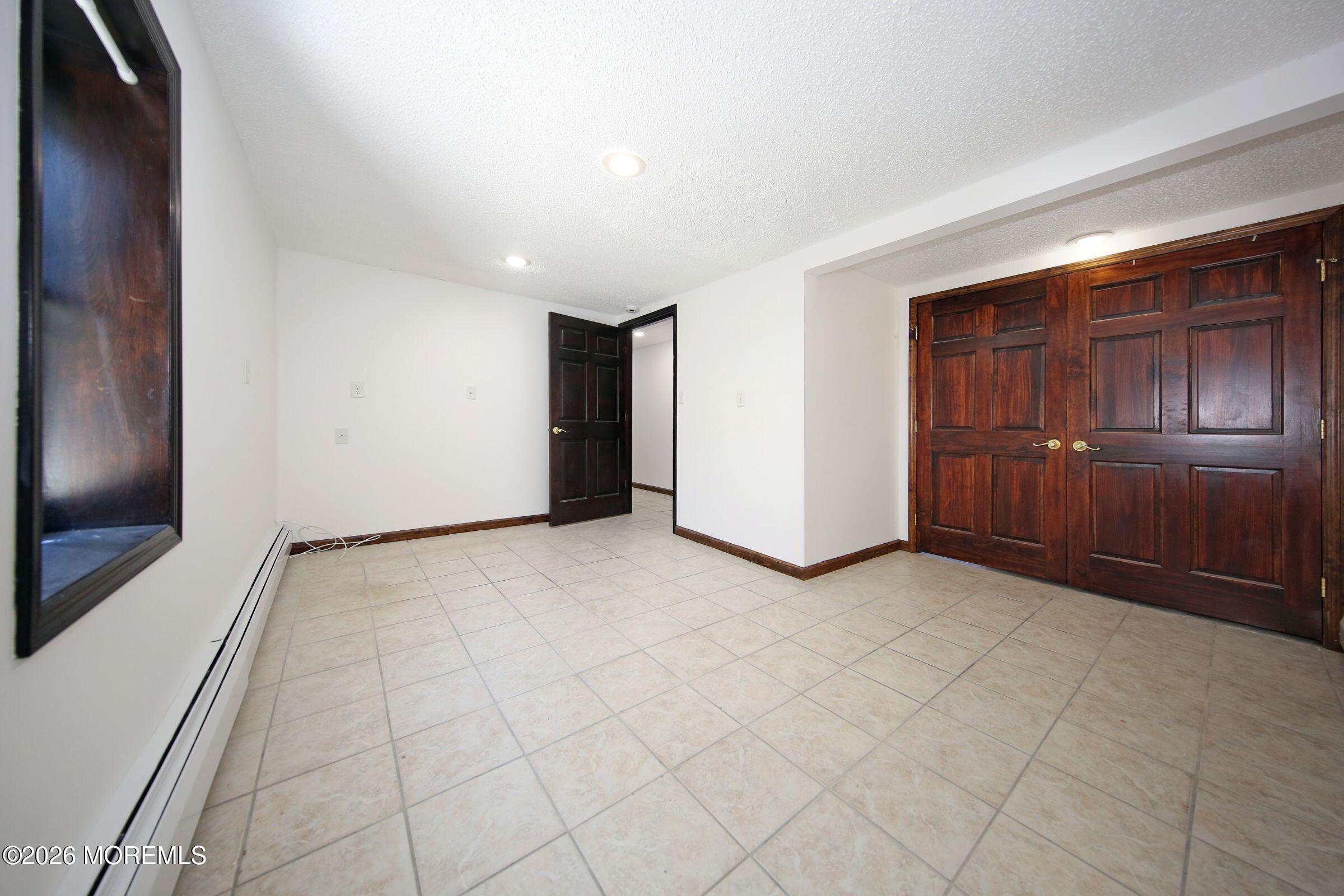 60 Matthew Street, Unit 1 Highlands, NJ 07732 - Photo 15 of 33 an empty room with closet