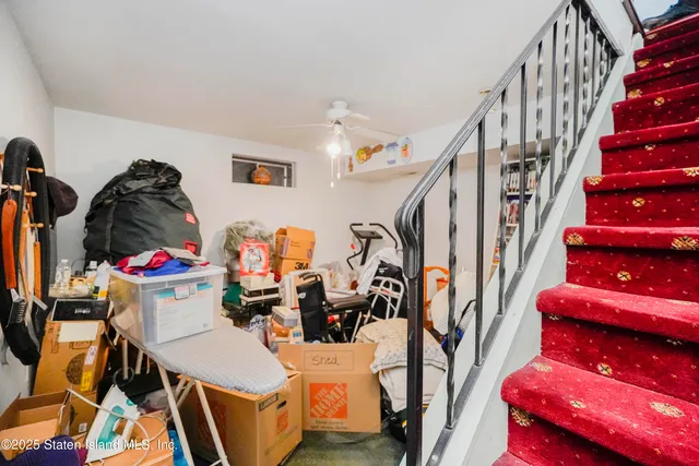 a view of a room with lots of stuff and furniture