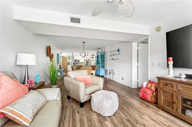 a bedroom with furniture and wooden floor