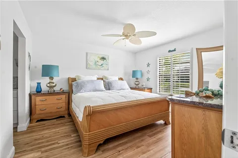 a bed room with a bed and a chandelier