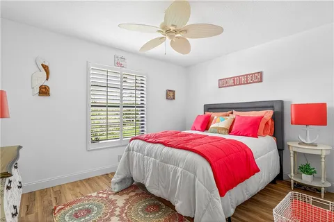 a bedroom with bed and a window