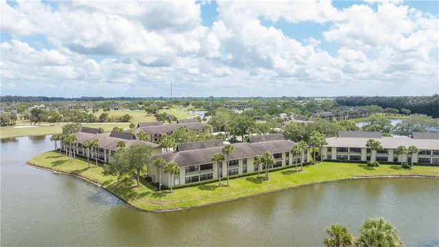 an aerial view of a residential houses with outdoor space