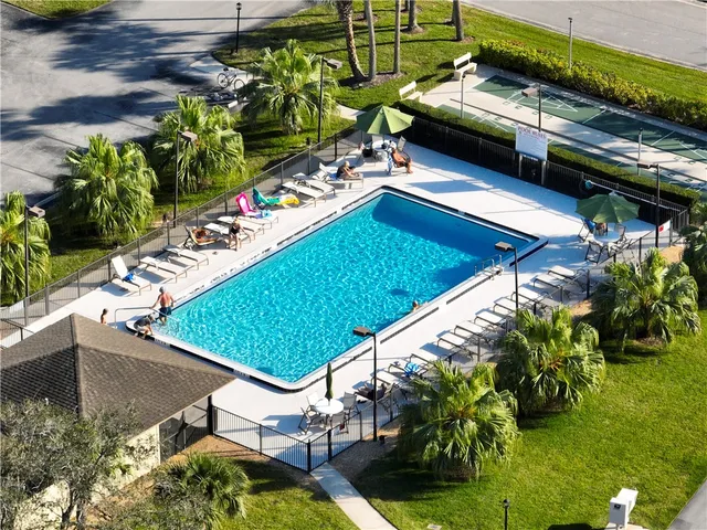 a view of a swimming pool with a patio