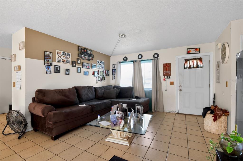 8821 Southeast 89th Place Ocala, FL 34472 - Photo 13 of 30 a living room with furniture and a couch