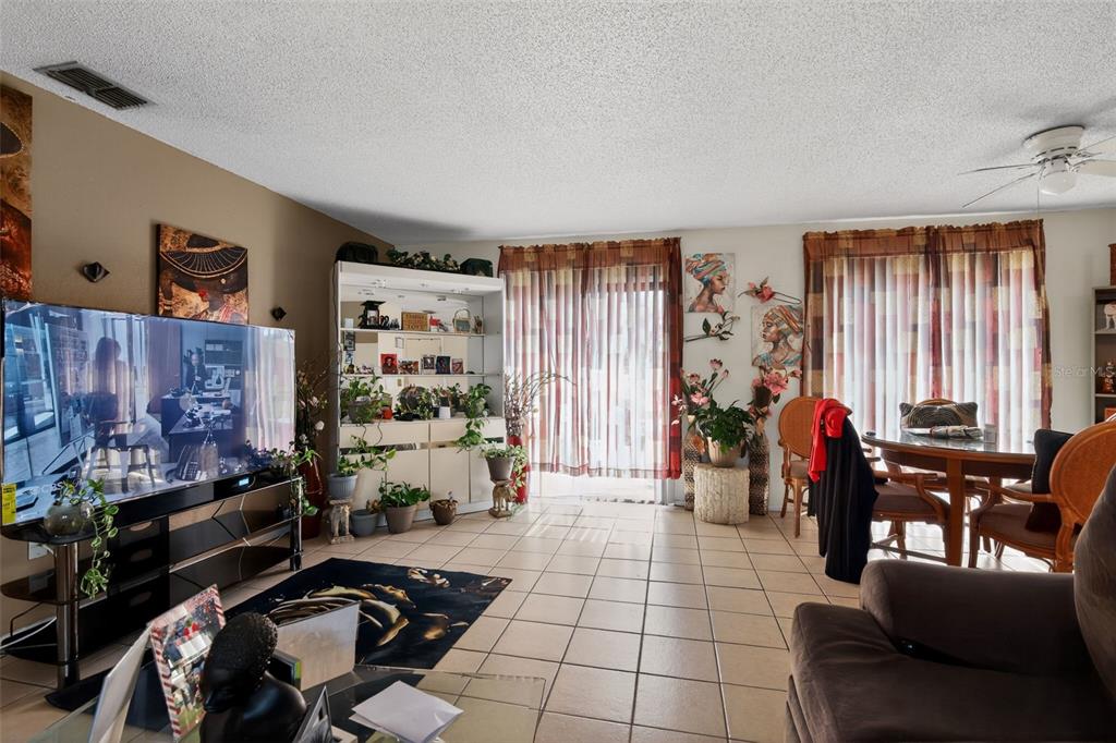 8821 Southeast 89th Place Ocala, FL 34472 - Photo 14 of 30 a living room with furniture and a window
