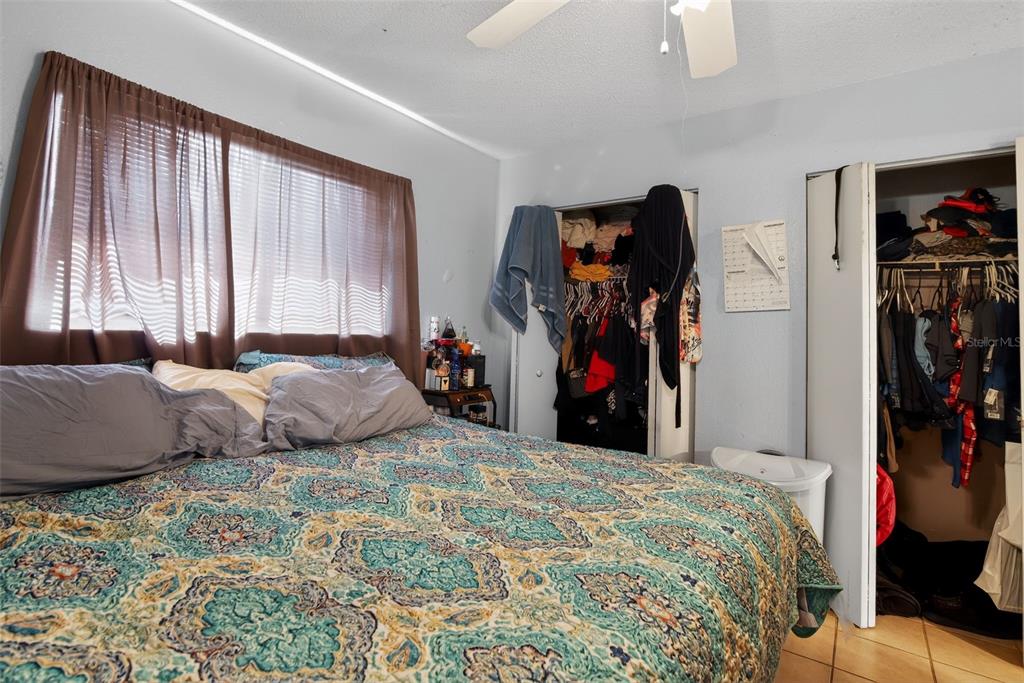 8821 Southeast 89th Place Ocala, FL 34472 - Photo 23 of 30 a bed room with a bed and a window