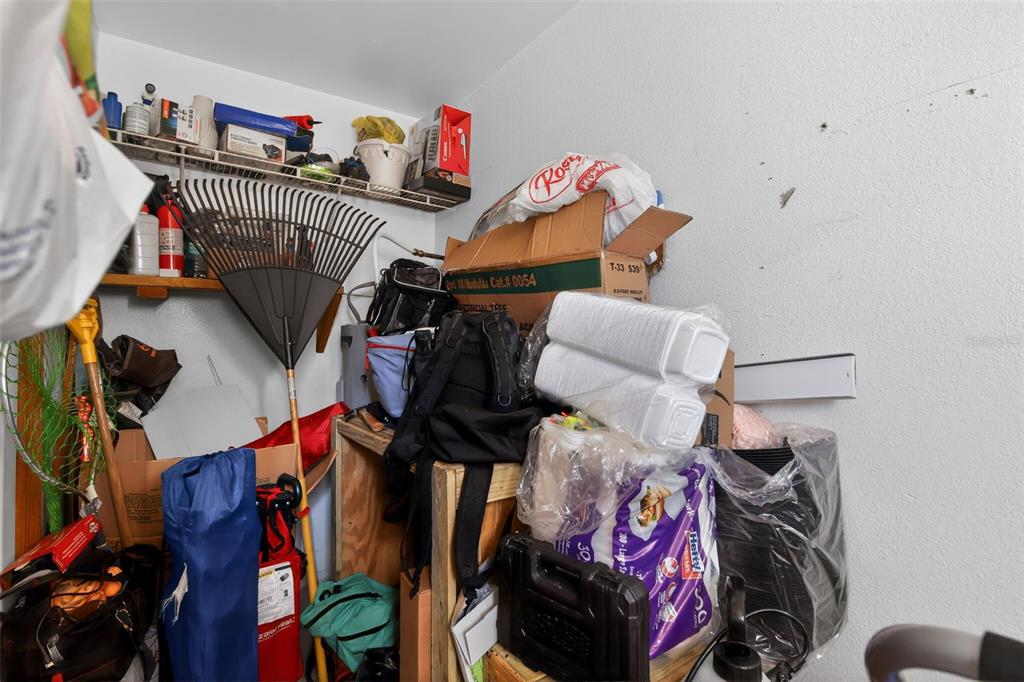 8821 Southeast 89th Place Ocala, FL 34472 - Photo 30 of 30 a view of walk in closet with clothes and shoes