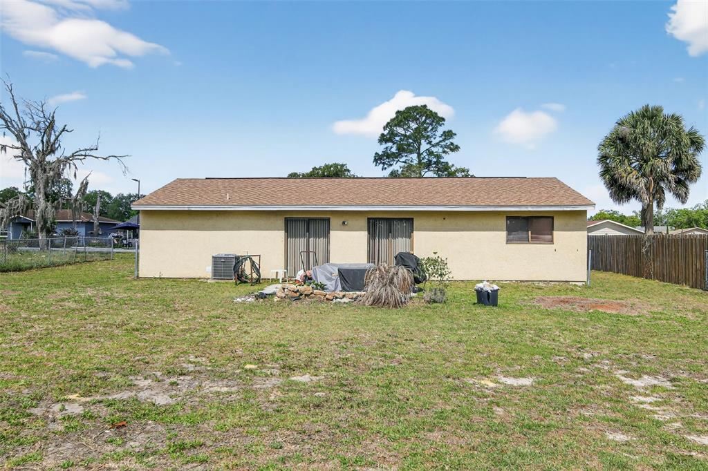 8821 Southeast 89th Place Ocala, FL 34472 - Photo 5 of 30 a view of a house with a yard and sitting area