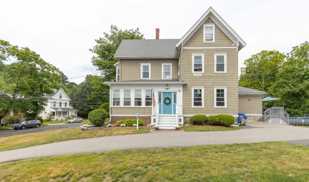 49 Spring Street Wakefield, MA 01880 - Photo 1 of 1 a front view of a house with a yard