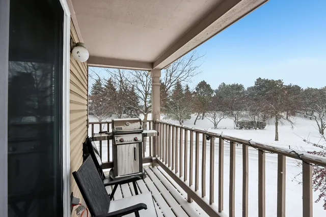 a view of a balcony with wooden floor