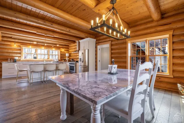 a living room with furniture a fireplace and a rug
