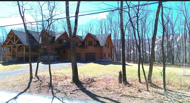 a view of a porch with a floor to ceiling windows