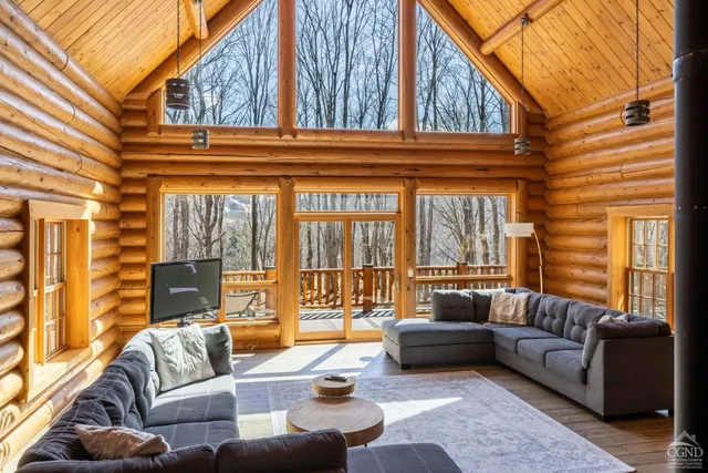 a outdoor living space with furniture and a large window