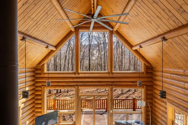 a view of a house with a big yard next to a house