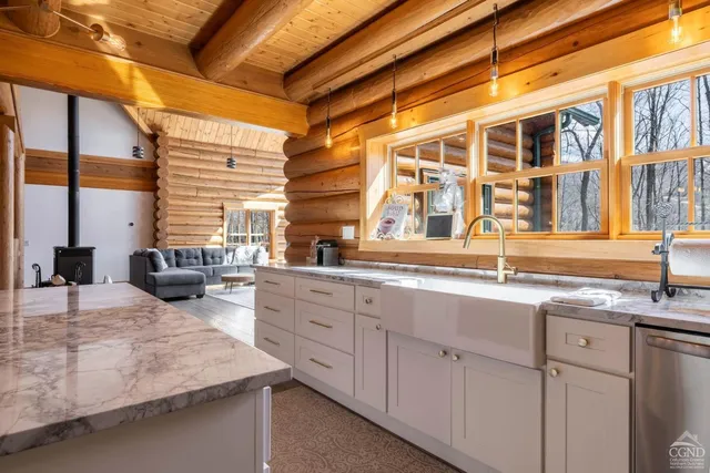 a kitchen with granite countertop a stove and a refrigerator