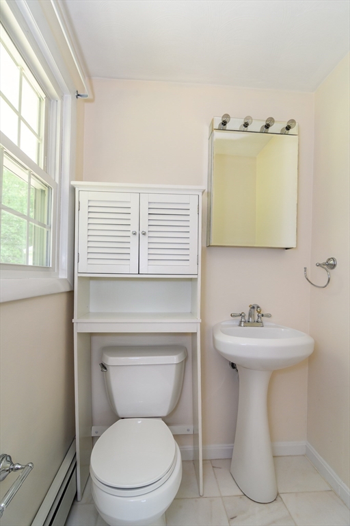 33 Eisenhower Road Framingham, MA 01701 - Photo 16 of 20 a bathroom with a toilet sink and mirror