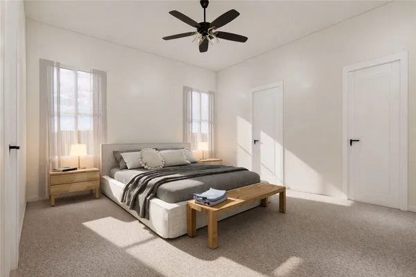 a spacious bedroom with a bed and window