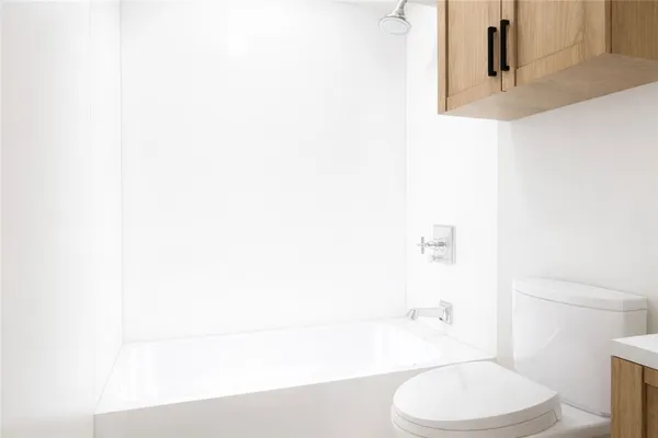 a bathroom with a toilet and a sink