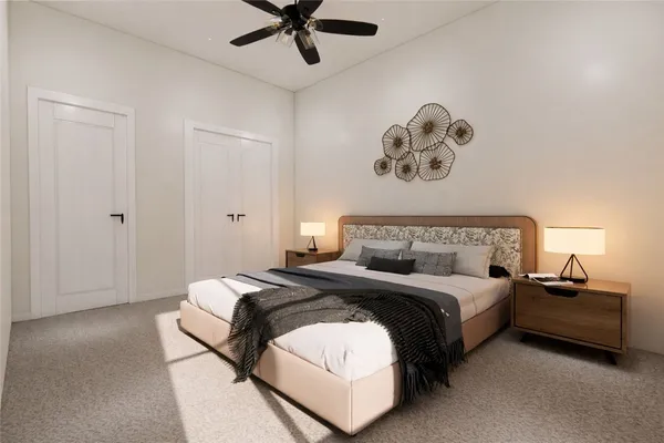 a bedroom with a bed and a chandelier