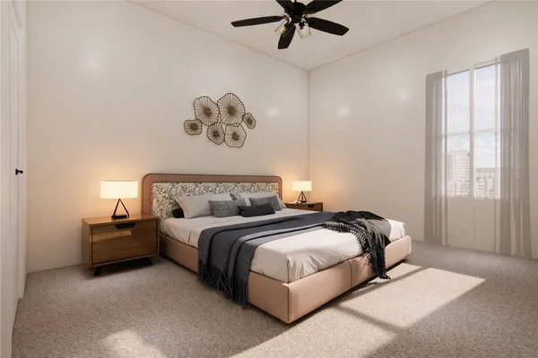 a bedroom with a bed and a painting on the wall